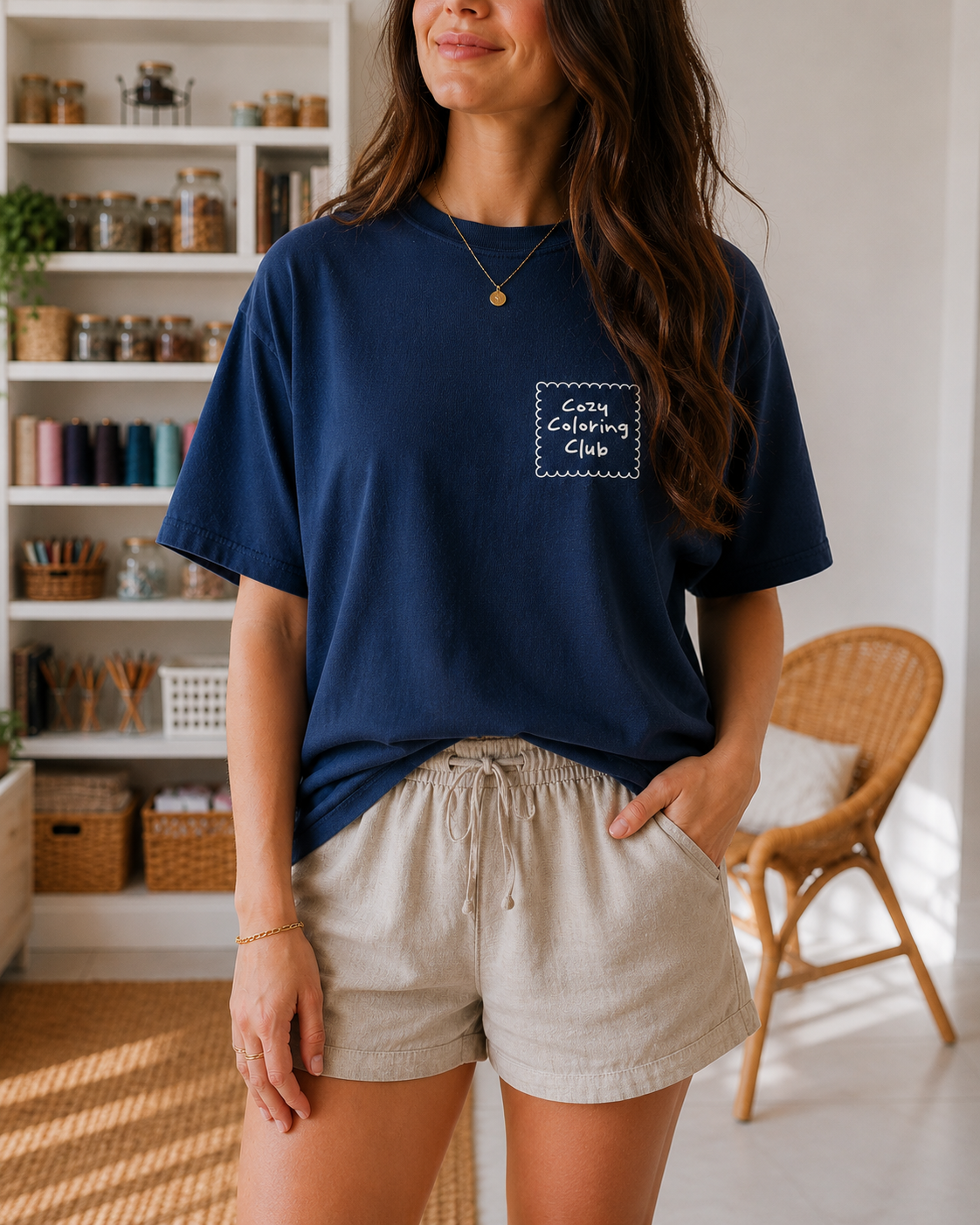 Model wearing oversized dark blue coloring book lover t-shirt, front view